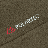 M-Tac Combat Fleece Polartec Jakke med Polartec logo, viser det slidstærke polyesterstof i nærbillede