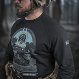 M-Tac Raglan Odin Mystery sweatshirt featuring Nordic god Odin design, perfect for casual or tactical style, worn by a man in a forest.