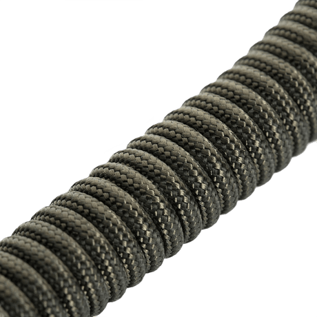 M-Tac Safety Cord med D-ring spiralformet sikkerhedssnor af paracord og PVC designet til at sikre udstyr mod tab eller tyveri.