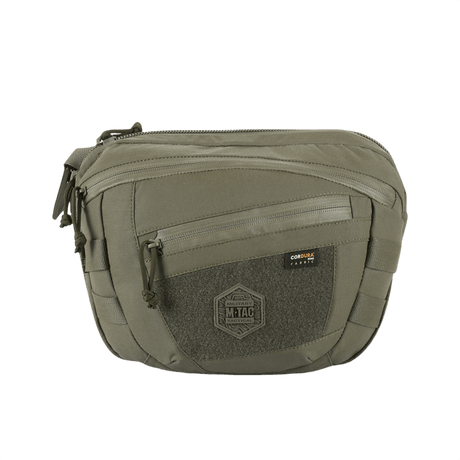 M-Tac Sphaera Hardsling Bag Large Elite med Velcro i olivengrøn med front Velcro-panel og justerbar skulderrem, lavet af slidstærk Cordura.