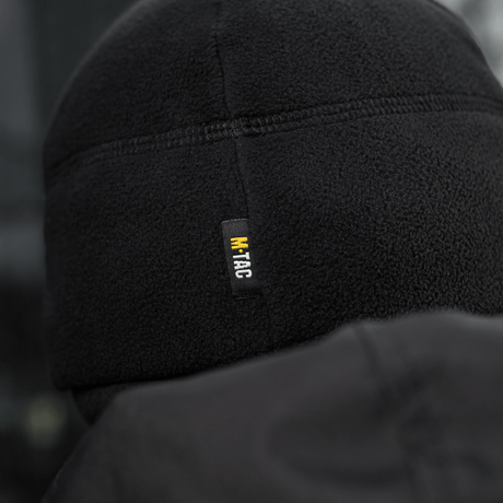 M-Tac Watch Cap Elite Fleece Beanie Hat Slimtex i sort fleece, set bagfra, visende M-Tac label. Perfekt til koldt vejr og taktisk brug.
